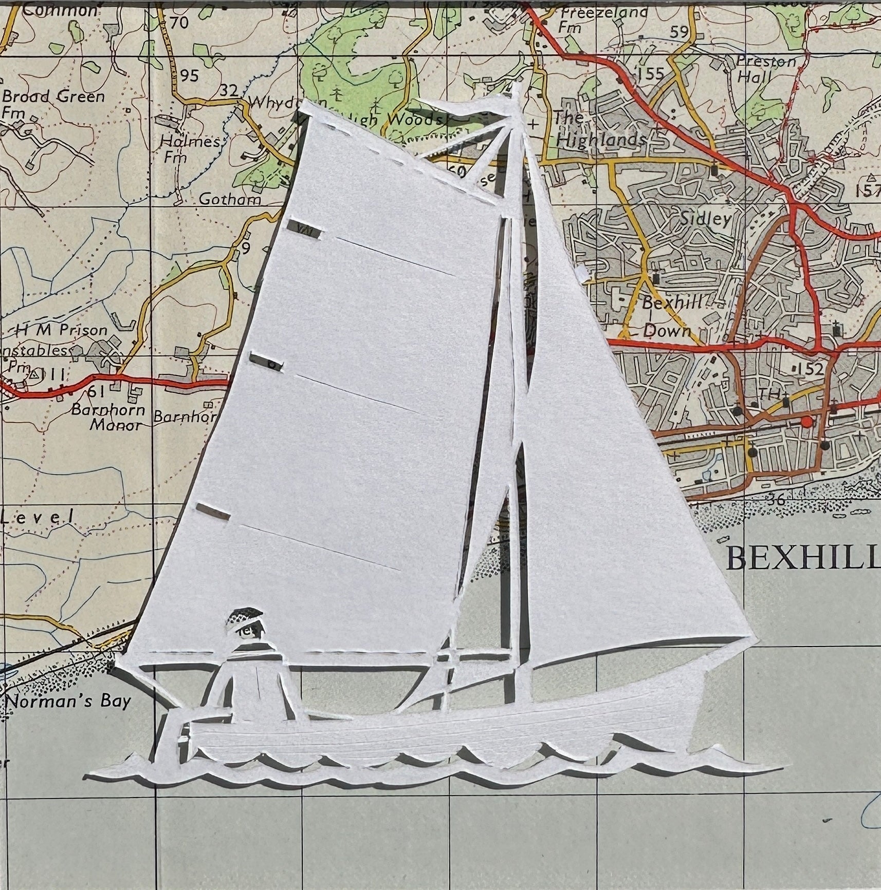 papercut of gaff rigged sailing boat on OS map